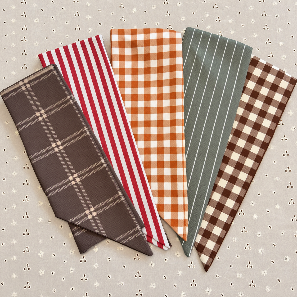 Five fall wreath sash fabric patterns: brown plaid, red stripe, orange gingham, green stripe, and brown gingham