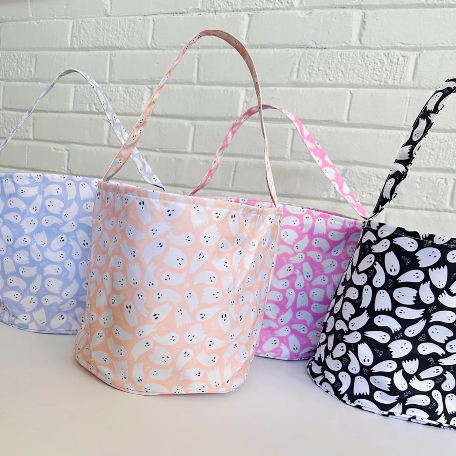 Ghost-print Halloween bucket bags in blue, orange, pink, and black