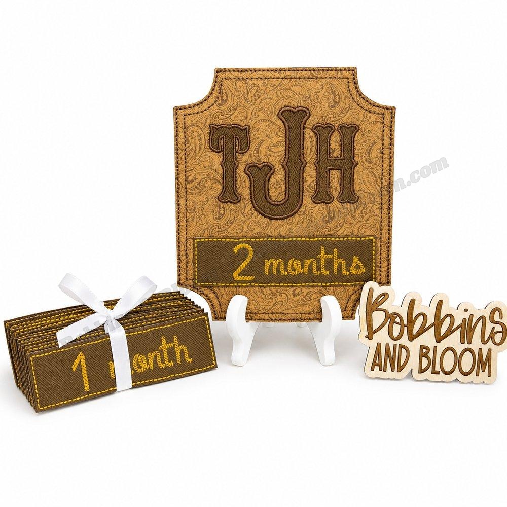 Embroidered TJH monogram milestone card set with wooden Bobbins and Bloom sign