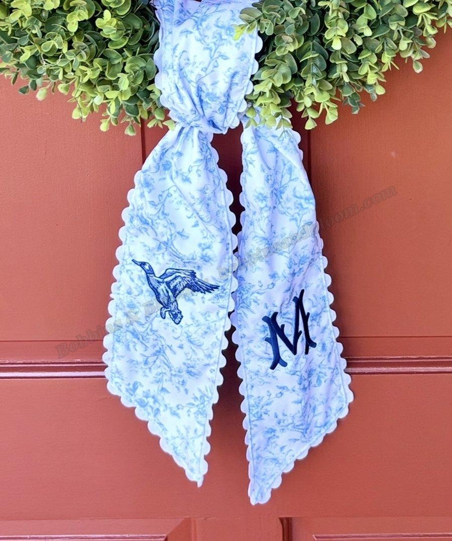 Blue duck toile wreath sash with flying duck and M monogram